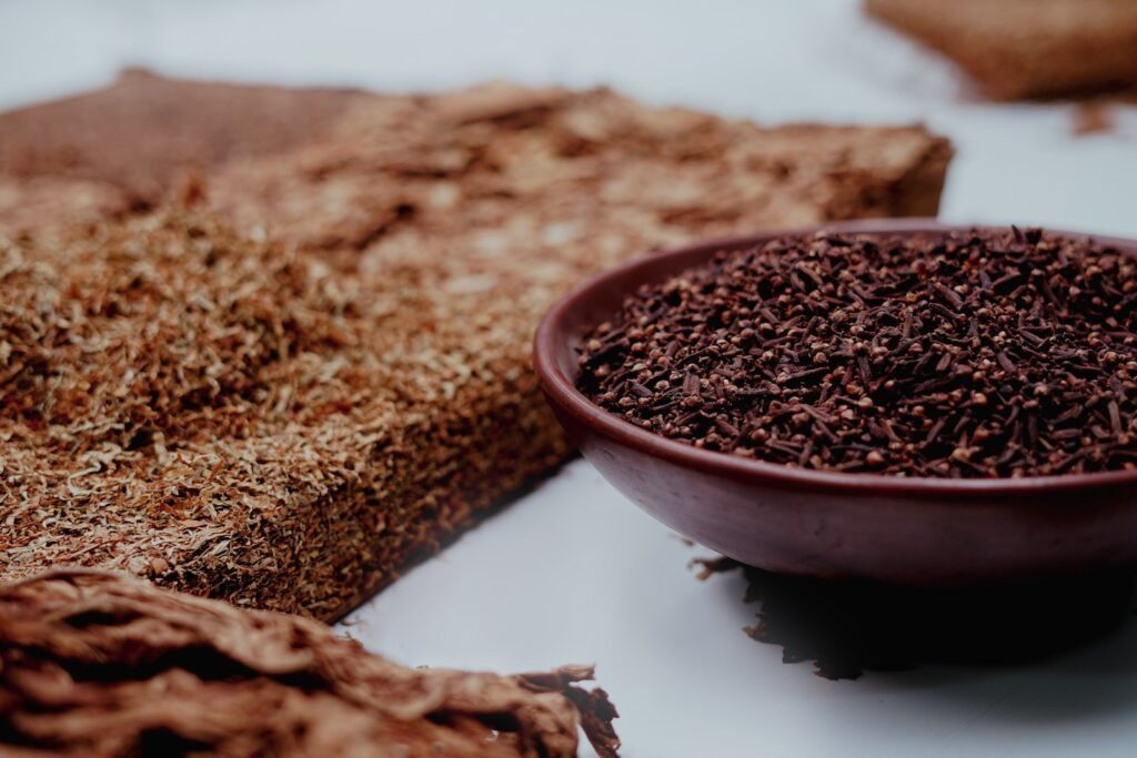 7 Surprising Benefits of Clove Oil for Teeth: Natural Dental Relief and More! 4 brown powder on white ceramic bowl