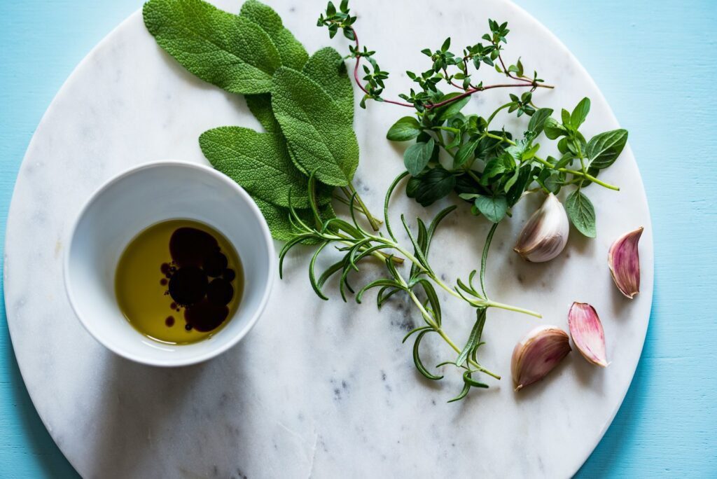flat lay photography of spices on plate, vetiver fragrance oil, organic vetiver essential oil, vetiver scent, young living vetiver

