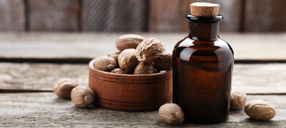 reshly grated nutmeg, nutmeg mill, organic nutmeg powder, nutmeg spray, nutmeg oil, soap, candle, spray